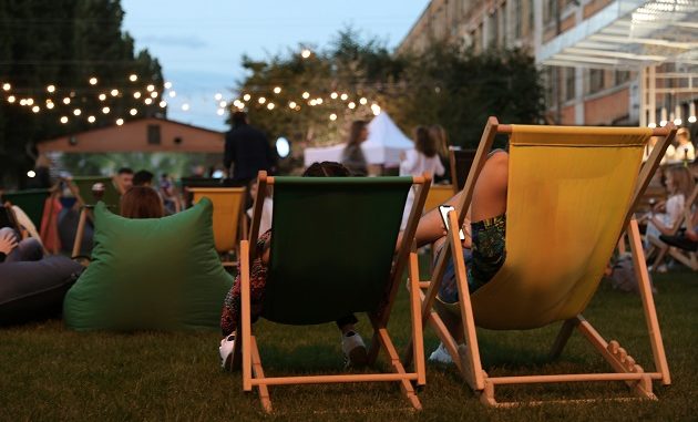 Modern open air cinema with comfortable seats in public park